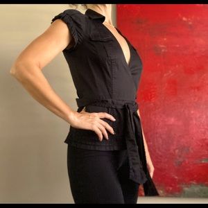 Diane Von Furstenberg black wrap top. Professional and chic! Soft sateen finish.